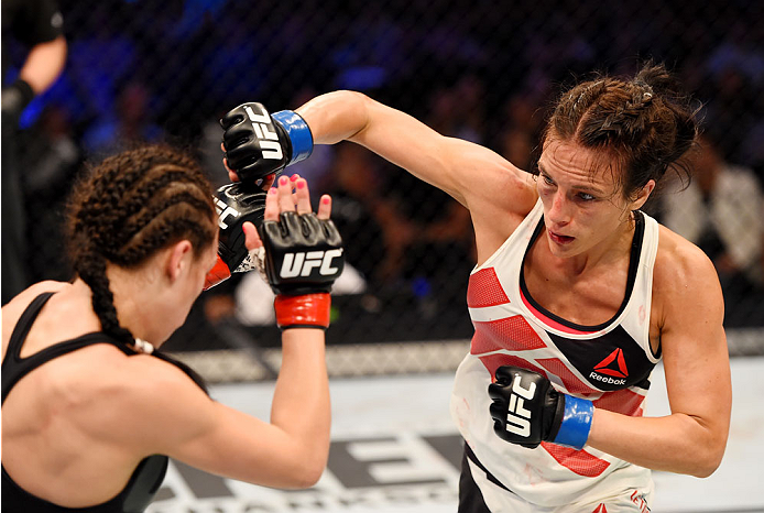 MELBOURNE, AUSTRALIA - NOVEMBER 15: Valerie Letourneau (R) throws a right-handed punch against Joanna Jedrzejczyk (L) in their UFC women's strawweight championship bout during the UFC 193 event at Etihad Stadium on November 15, 2015 in Melbourne, Austral