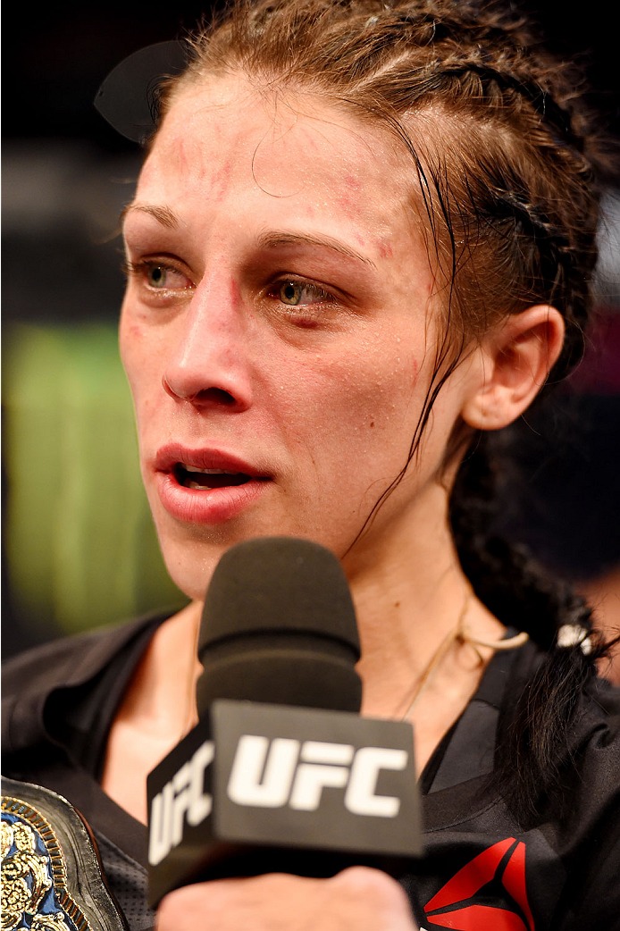 MELBOURNE, AUSTRALIA - NOVEMBER 15: Joanna Jedrzejczyk celebrates her championship win by Unanimous Decision after five rounds against Valerie Letourneau (not pictured) in their UFC women's strawweight championship bout during the UFC 193 event at Etihad