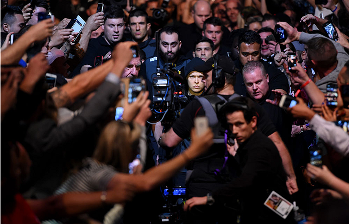 MELBOURNE, AUSTRALIA - NOVEMBER 15: Ronda Rousey walks to the Octagon surrounded by fans before facing Holly Holm (not pictured) in their UFC women's bantamweight championship bout during the UFC 193 event at Etihad Stadium on November 15, 2015 in Melbou