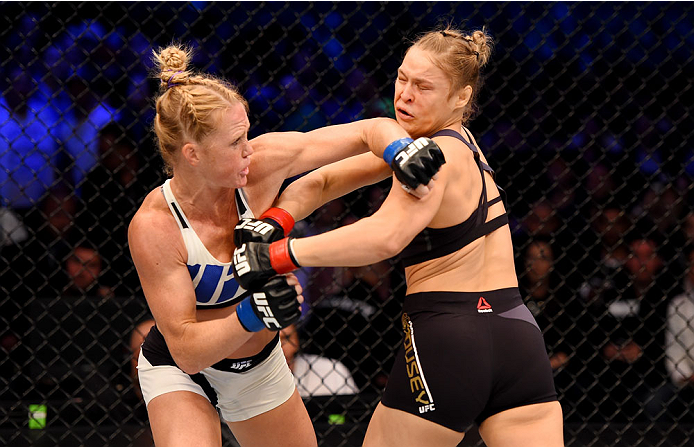 MELBOURNE, AUSTRALIA - NOVEMBER 15: Holly Holm (L) throws a left-handed punch against Ronda Rousey (R) in the first round of their UFC women's bantamweight championship bout during the UFC 193 event at Etihad Stadium on November 15, 2015 in Melbourne, Au