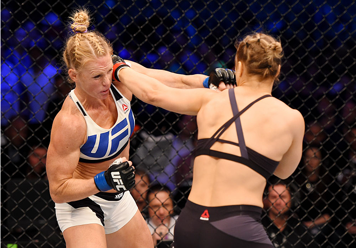 MELBOURNE, AUSTRALIA - NOVEMBER 15: (L-R) Holly Holm and Ronda Rousey exchange punches in the first round of their UFC women's bantamweight championship bout during the UFC 193 event at Etihad Stadium on November 15, 2015 in Melbourne, Australia. (Phot