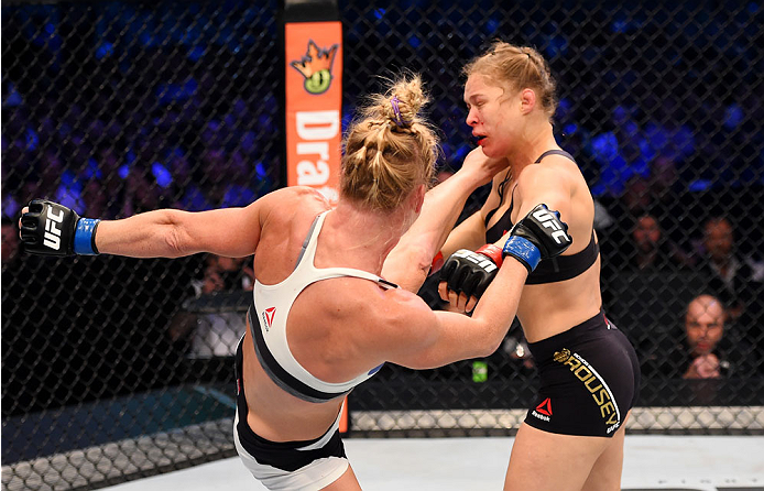 MELBOURNE, AUSTRALIA - NOVEMBER 15: (L-R) Holly Holm lands a left-high kick against Ronda Rousey in the second round of their UFC women's bantamweight championship bout during the UFC 193 event at Etihad Stadium on November 15, 2015 in Melbourne, Australi