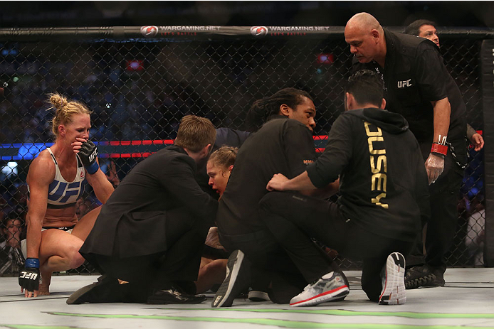 MELBOURNE, AUSTRALIA - NOVEMBER 15: Ronda Rousey of the United States receives medical treatment after being defeated by Holly Holm of the United States in their UFC women's bantamweight championship bout during the UFC 193 event at Etihad Stadium on Nov