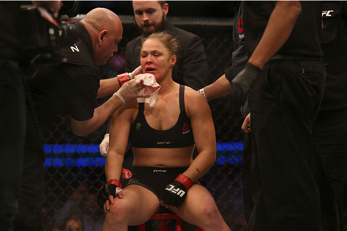 MELBOURNE, AUSTRALIA - NOVEMBER 15: Ronda Rousey of the United States receives medical treatment after being defeated by Holly Holm of the United States in their UFC women's bantamweight championship bout during the UFC 193 event at Etihad Stadium on Nov