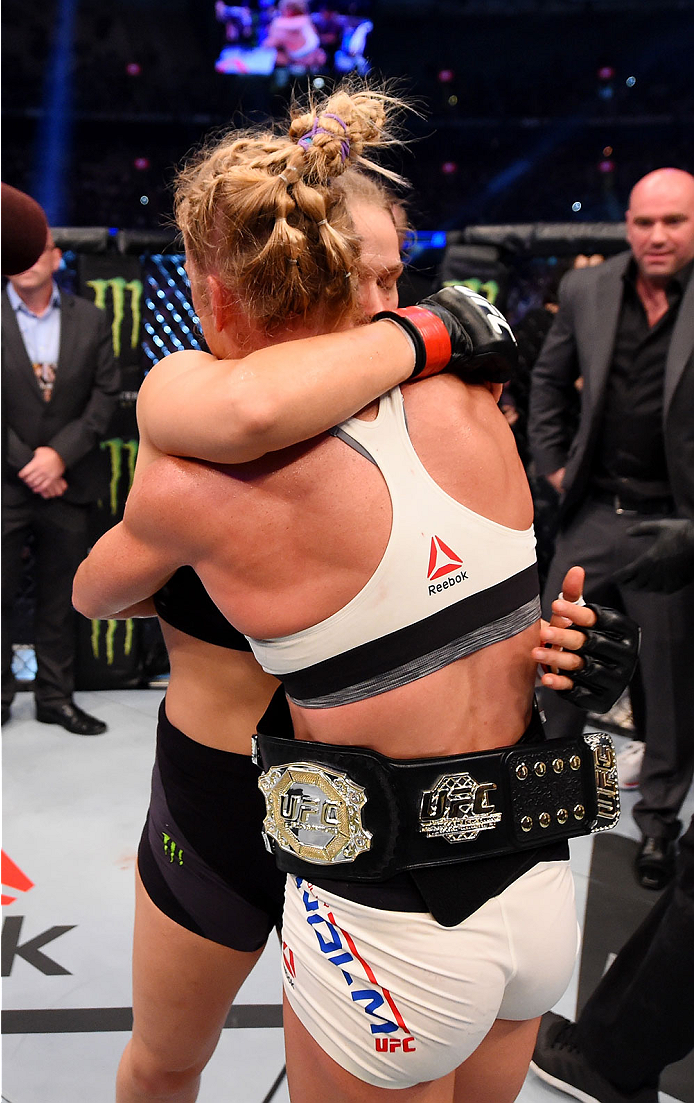 MELBOURNE, AUSTRALIA - NOVEMBER 15: Holly Holm (R) is congratulated by Ronda Rousey (L) after Holm won by KO (head kick and punches) in two rounds of their UFC women's bantamweight championship bout during the UFC 193 event at Etihad Stadium on November
