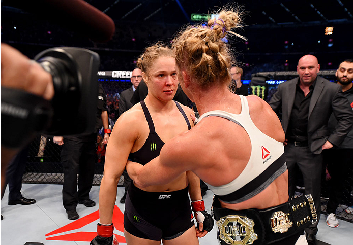MELBOURNE, AUSTRALIA - NOVEMBER 15: Holly Holm (R) is congratulated by Ronda Rousey (L) after Holm won by KO (head kick and punches) in two rounds of their UFC women's bantamweight championship bout during the UFC 193 event at Etihad Stadium on November