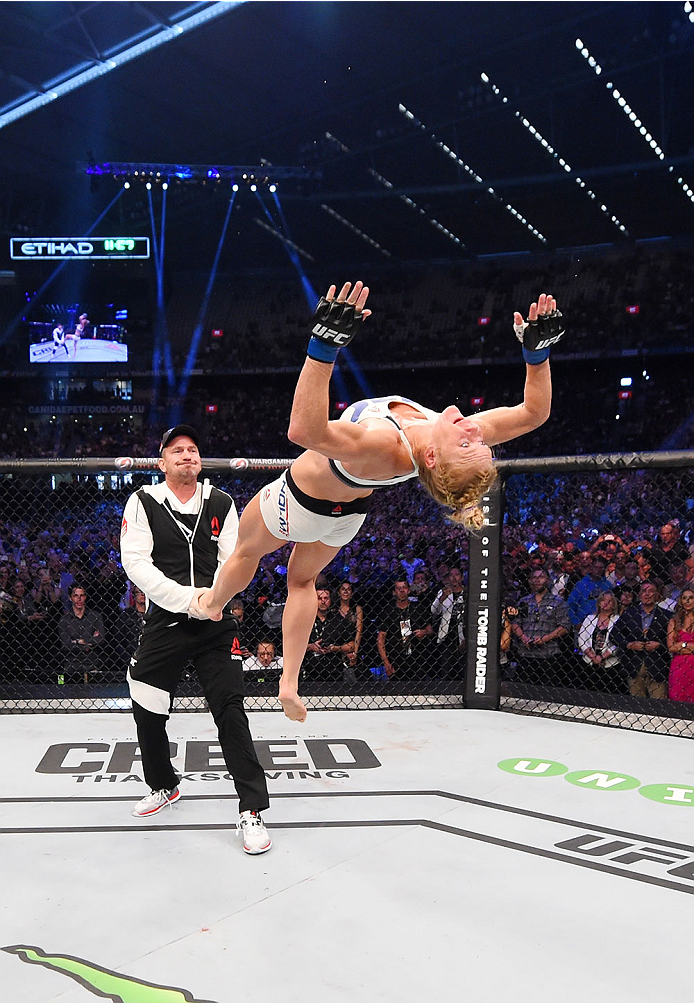 MELBOURNE, AUSTRALIA - NOVEMBER 15: Holly Holm does a back-flip in celebrateion of her second round KO (head kick and punches) over Ronda Rousey (not pictured) to win their UFC women's bantamweight championship bout during the UFC 193 event at Etihad Sta