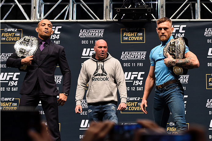 LAS VEGAS, NV - DECEMBER 09: (L-R) Opponents Jose Aldo of Brazil and Conor McGregor of Ireland pose for photos during the UFC Press Conference inside MGM Grand Garden Arena on December 9, 2015 in Las Vegas, Nevada. (Photo by Josh Hedges/Zuffa LLC/Zuffa