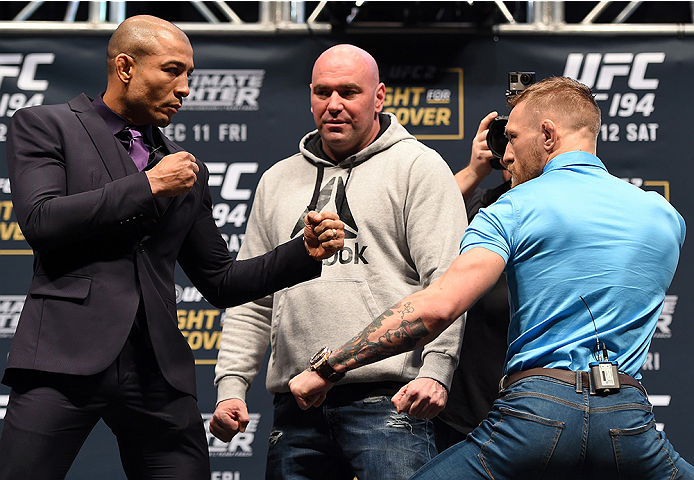 LAS VEGAS, NV - DECEMBER 09: (L-R) Opponents Jose Aldo of Brazil and Conor McGregor of Ireland face off during the UFC Press Conference inside MGM Grand Garden Arena on December 9, 2015 in Las Vegas, Nevada. (Photo by Josh Hedges/Zuffa LLC/Zuffa LLC via