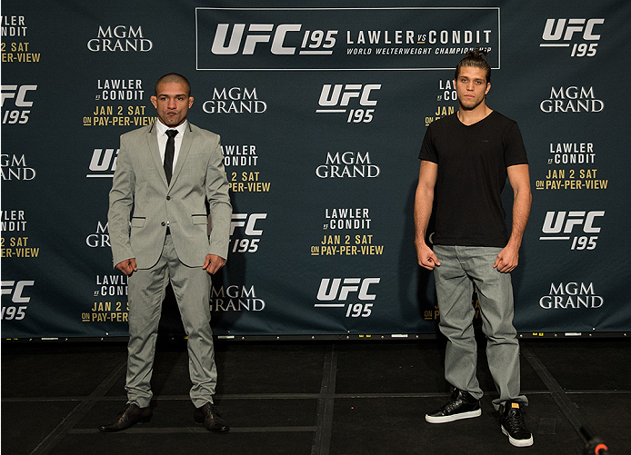 LAS VEGAS, NEVADA - DECEMBER 31: (L-R) Diego Brandao and Brian Ortega pose for a photo after facing off during the Ultimate Media Day at the MGM Grand Hotel/Casino on December 31, 2015 in Las Vegas Nevada. (Photo by Brandon Magnus/Zuffa LLC/Zuffa LLC via