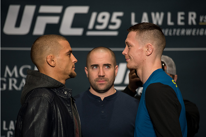 LAS VEGAS, NEVADA - DECEMBER 31: (L-R) Dustin Poirier and Joe Duffey face off during the Ultimate Media Day at the MGM Grand Hotel/Casino on December 31, 2015 in Las Vegas Nevada. (Photo by Brandon Magnus/Zuffa LLC/Zuffa LLC via Getty Images)