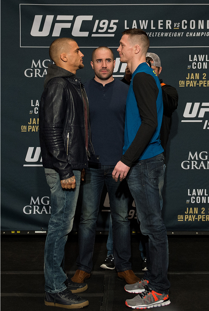 LAS VEGAS, NEVADA - DECEMBER 31: (L-R) Dustin Poirier and Joe Duffey face off during the Ultimate Media Day at the MGM Grand Hotel/Casino on December 31, 2015 in Las Vegas Nevada. (Photo by Brandon Magnus/Zuffa LLC/Zuffa LLC via Getty Images)