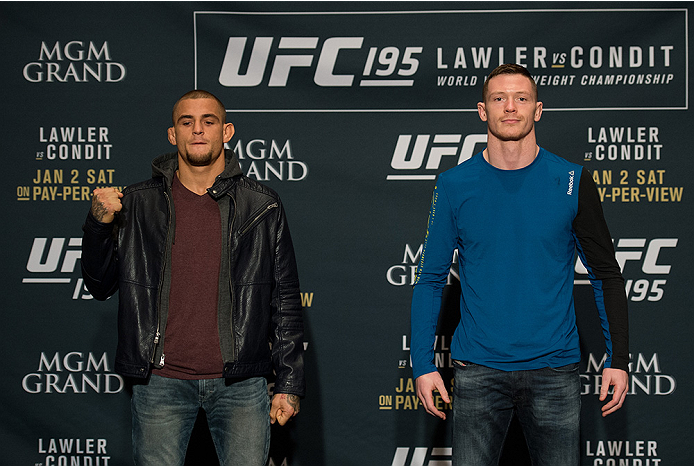 LAS VEGAS, NEVADA - DECEMBER 31: (L-R) Dustin Poirier and Joe Duffey pose for a picture after facing off during the Ultimate Media Day at the MGM Grand Hotel/Casino on December 31, 2015 in Las Vegas Nevada. (Photo by Brandon Magnus/Zuffa LLC/Zuffa LLC vi