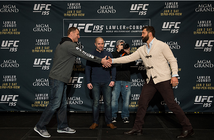 LAS VEGAS, NEVADA - DECEMBER 31: (L-R) Stipe Miocic and Andrei Arlovski face off during the Ultimate Media Day at the MGM Grand Hotel/Casino on December 31, 2015 in Las Vegas Nevada. (Photo by Brandon Magnus/Zuffa LLC/Zuffa LLC via Getty Images)