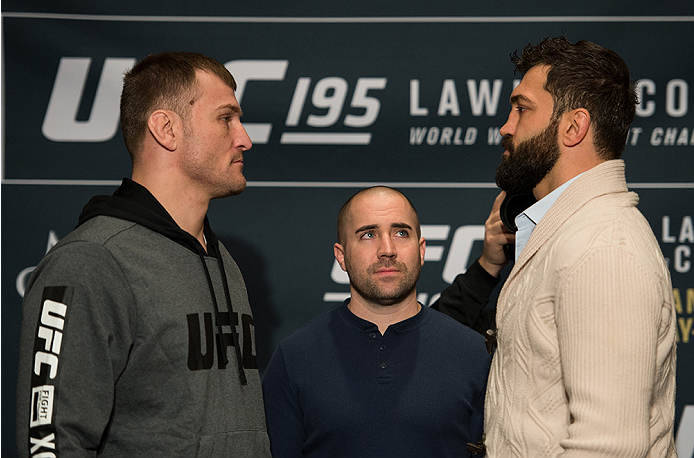 LAS VEGAS, NEVADA - DECEMBER 31: (L-R) Stipe Miocic and Andrei Arlovski face off during the Ultimate Media Day at the MGM Grand Hotel/Casino on December 31, 2015 in Las Vegas Nevada. (Photo by Brandon Magnus/Zuffa LLC/Zuffa LLC via Getty Images)