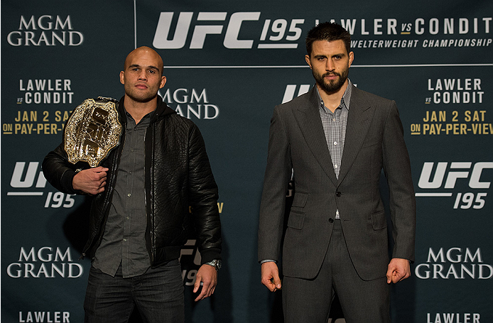 LAS VEGAS, NEVADA - DECEMBER 31: (L-R) UFC welterweight champion Robbie Lawler and Carlos Condit pose for a picture after facing off during the Ultimate Media Day at the MGM Grand Hotel/Casino on December 31, 2015 in Las Vegas Nevada. (Photo by Brandon M