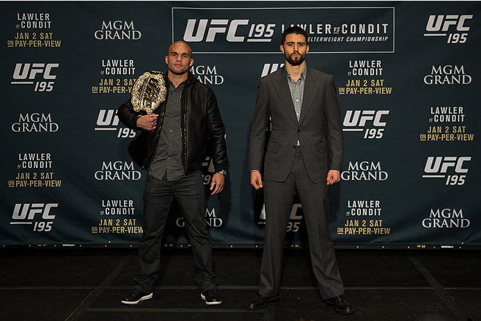 LAS VEGAS, NEVADA - DECEMBER 31: (L-R) UFC welterweight champion Robbie Lawler and Carlos Condit pose for a picture after facing off during the Ultimate Media Day at the MGM Grand Hotel/Casino on December 31, 2015 in Las Vegas Nevada. (Photo by Brandon M