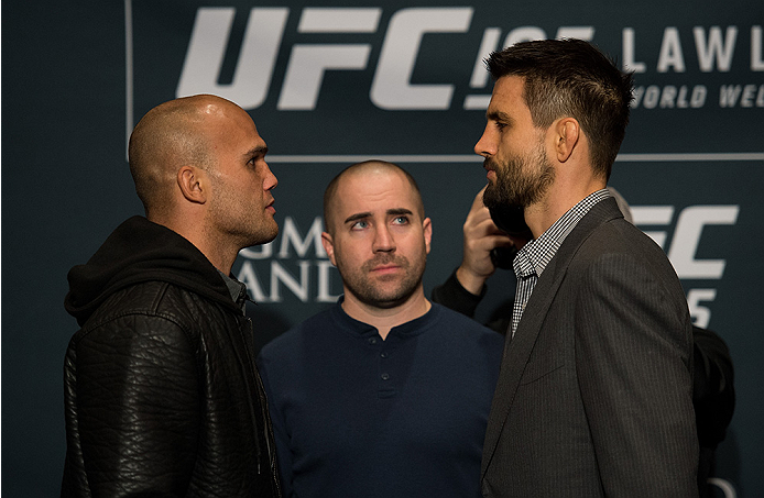 LAS VEGAS, NEVADA - DECEMBER 31: (L-R) UFC welterweight champion Robbie Lawler and Carlos Condit face off during the Ultimate Media Day at the MGM Grand Hotel/Casino on December 31, 2015 in Las Vegas Nevada. (Photo by Brandon Magnus/Zuffa LLC/Zuffa LLC v