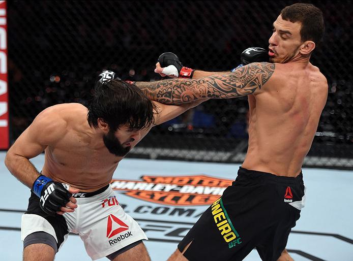 CURITIBA, BRAZIL - MAY 14: (L-R) Zubaira Tukhugov of Russia punches Renato Moicano of Brazil in their featherweight bout during the UFC 198 event at Arena da Baixada stadium on May 14, 2016 in Curitiba, Parana, Brazil. (Photo by Josh Hedges/Zuffa LLC/Zu