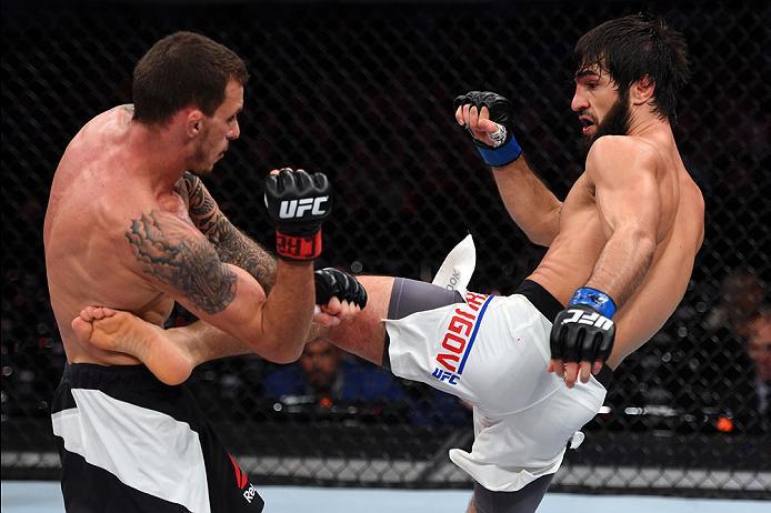 CURITIBA, BRAZIL - MAY 14: (R-L) Zubaira Tukhugov of Russia kicks Renato Moicano of Brazil in their featherweight bout during the UFC 198 event at Arena da Baixada stadium on May 14, 2016 in Curitiba, Parana, Brazil. (Photo by Josh Hedges/Zuffa LLC/Zuff
