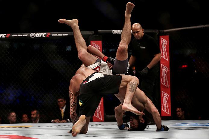 CURITIBA, BRAZIL - MAY 14: Renato Mocaio of Brazil competes Zubaira Tukhugov of Russia in their featherweight bout during the UFC 198 at Arena da Baixada stadium on May 14, 2016 in Curitiba, Brazil. (Photo by Buda Mendes/Zuffa LLC/Zuffa LLC via Getty Imag
