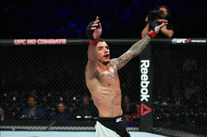CURITIBA, BRAZIL - MAY 14: Renato Moicano of Brazil celebrates after defeating Zubaira Tukhugov of Russia in their featherweight bout during the UFC 198 event at Arena da Baixada stadium on May 14, 2016 in Curitiba, Parana, Brazil. (Photo by Josh Hedges
