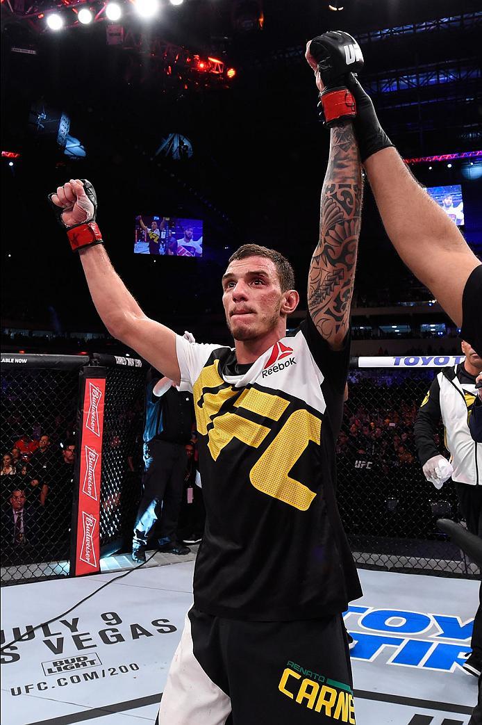 CURITIBA, BRAZIL - MAY 14: Renato Moicano of Brazil celebrates after defeating Zubaira Tukhugov of Russia in their featherweight bout during the UFC 198 event at Arena da Baixada stadium on May 14, 2016 in Curitiba, Parana, Brazil. (Photo by Josh Hedges