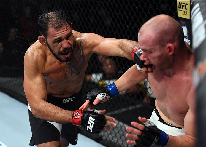 CURITIBA, BRAZIL - MAY 14: (L-R) Antonio Rogerio Nogueira of Brazil punches Patrick Cummins in their light heavyweight bout during the UFC 198 event at Arena da Baixada stadium on May 14, 2016 in Curitiba, Parana, Brazil. (Photo by Josh Hedges/Zuffa LLC