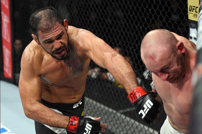 CURITIBA, BRAZIL - MAY 14: (L-R) Antonio Rogerio Nogueira of Brazil punches Patrick Cummins in their light heavyweight bout during the UFC 198 event at Arena da Baixada stadium on May 14, 2016 in Curitiba, Parana, Brazil. (Photo by Josh Hedges/Zuffa LLC