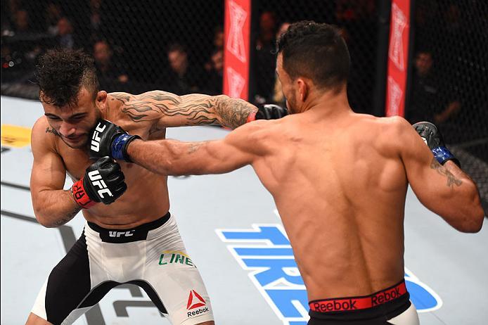 CURITIBA, BRAZIL - MAY 14: (R-L) Rob Font punches John Lineker of Brazil in their bantamweight bout during the UFC 198 event at Arena da Baixada stadium on May 14, 2016 in Curitiba, Parana, Brazil. (Photo by Josh Hedges/Zuffa LLC/Zuffa LLC via Getty Ima