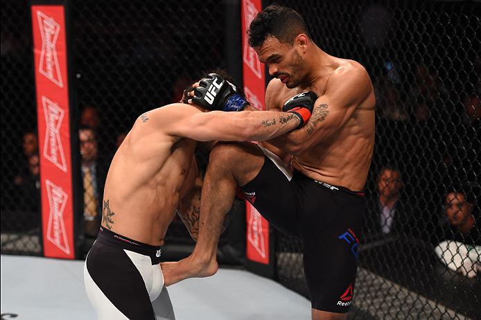 CURITIBA, BRAZIL - MAY 14: (R-L) Rob Font throws a knee to the head of John Lineker of Brazil in their bantamweight bout during the UFC 198 event at Arena da Baixada stadium on May 14, 2016 in Curitiba, Parana, Brazil. (Photo by Josh Hedges/Zuffa LLC/Zu