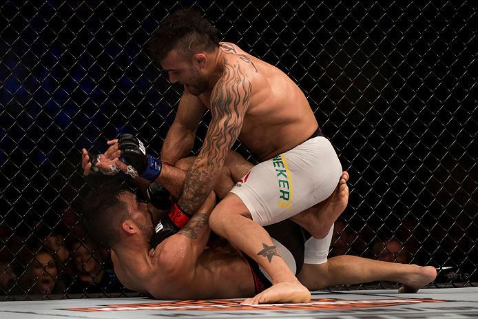 CURITIBA, BRAZIL - MAY 14: Jonh Lineker of Brazil punches Rob Font of the United States in their bantamweight bout during the UFC 198 at Arena da Baixada stadium on May 14, 2016 in Curitiba, Brazil. (Photo by Buda Mendes/Zuffa LLC/Zuffa LLC via Getty Imag