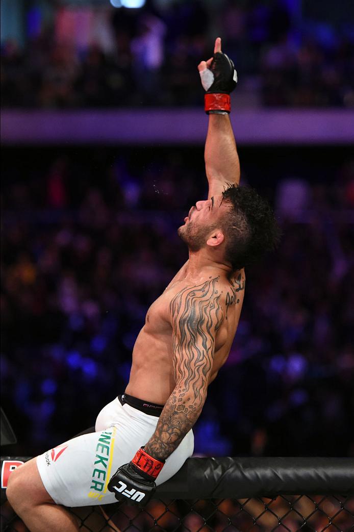 CURITIBA, BRAZIL - MAY 14: John Lineker of Brazil celebrates after defeating Rob Font by unanimous decision in their bantamweight bout during the UFC 198 event at Arena da Baixada stadium on May 14, 2016 in Curitiba, Parana, Brazil. (Photo by Josh Hedge