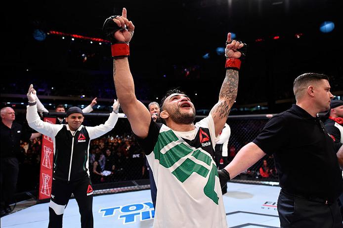 CURITIBA, BRAZIL - MAY 14: John Lineker of Brazil celebrates after defeating Rob Font by unanimous decision in their bantamweight bout during the UFC 198 event at Arena da Baixada stadium on May 14, 2016 in Curitiba, Parana, Brazil. (Photo by Josh Hedge