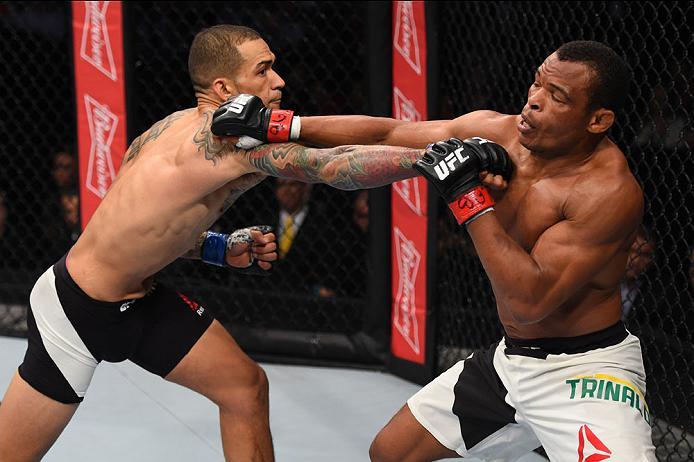 CURITIBA, BRAZIL - MAY 14: (L-R) Yancy Medeiros punches Francisco Trinaldo of Brazil in their lightweight bout during the UFC 198 event at Arena da Baixada stadium on May 14, 2016 in Curitiba, Parana, Brazil. (Photo by Josh Hedges/Zuffa LLC/Zuffa LLC vi