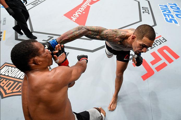 CURITIBA, BRAZIL - MAY 14: (R-L) Yancy Medeiros punches Francisco Trinaldo of Brazil in their lightweight bout during the UFC 198 event at Arena da Baixada stadium on May 14, 2016 in Curitiba, Parana, Brazil. (Photo by Josh Hedges/Zuffa LLC/Zuffa LLC vi