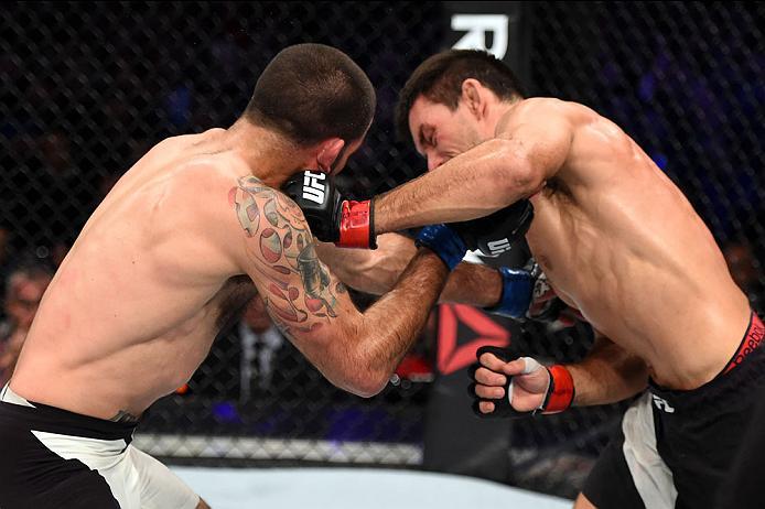 CURITIBA, BRAZIL - MAY 14: (R-L) Demian Maia of Brazil punches Matt Brown in their welterweight bout during the UFC 198 event at Arena da Baixada stadium on May 14, 2016 in Curitiba, Parana, Brazil. (Photo by Josh Hedges/Zuffa LLC/Zuffa LLC via Getty Im