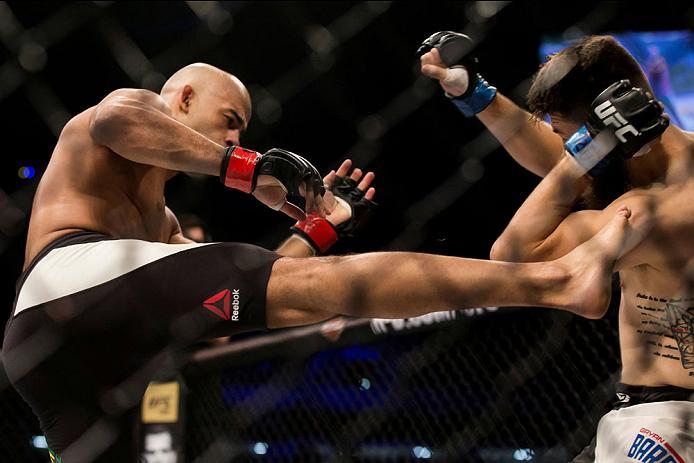 CURITIBA, BRAZIL - MAY 14: Warlley Alves of Brazil kicks Bryan Barberena of the United States in their welterweight bout during the UFC 198 at Arena da Baixada stadium on May 14, 2016 in Curitiba, Brazil. (Photo by Buda Mendes/Zuffa LLC/Zuffa LLC via Gett