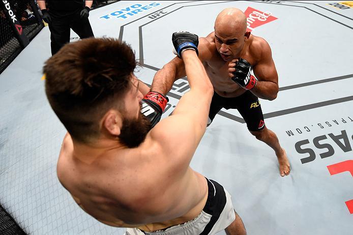 CURITIBA, BRAZIL - MAY 14: (R-L) Warlley Alves of Brazil punches Bryan Barberena in their middleweight bout during the UFC 198 event at Arena da Baixada stadium on May 14, 2016 in Curitiba, Parana, Brazil. (Photo by Josh Hedges/Zuffa LLC/Zuffa LLC via G