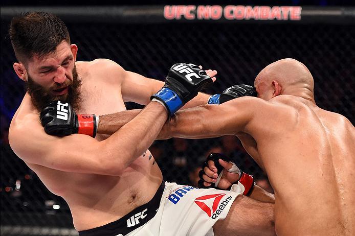 CURITIBA, BRAZIL - MAY 14: (R-L) Warlley Alves of Brazil punches Bryan Barberena in their middleweight bout during the UFC 198 event at Arena da Baixada stadium on May 14, 2016 in Curitiba, Parana, Brazil. (Photo by Josh Hedges/Zuffa LLC/Zuffa LLC via G