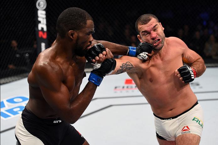 CURITIBA, BRAZIL - MAY 14: (L-R) Corey Anderson and Mauricio 'Shogun' Rua of Brazil exchange punches in their light heavyweight bout during the UFC 198 event at Arena da Baixada stadium on May 14, 2016 in Curitiba, Parana, Brazil. (Photo by Josh Hedges/