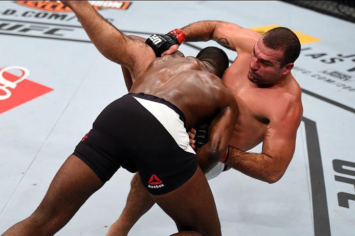 CURITIBA, BRAZIL - MAY 14: (L-R) Corey Anderson takes down Mauricio 'Shogun' Rua of Brazil in their light heavyweight bout during the UFC 198 event at Arena da Baixada stadium on May 14, 2016 in Curitiba, Parana, Brazil. (Photo by Josh Hedges/Zuffa LLC/