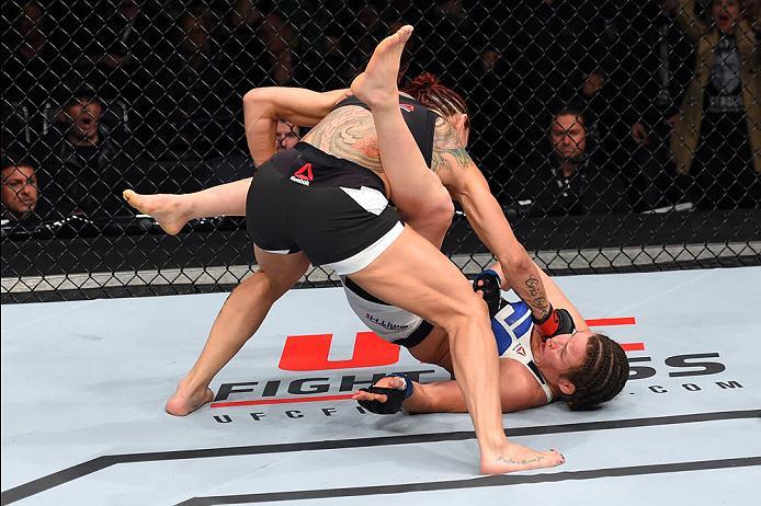 CURITIBA, BRAZIL - MAY 14: (L-R) Cristiane 'Cyborg' Justino of Brazil punches Leslie Smith in their women's catchweight bout during the UFC 198 event at Arena da Baixada stadium on May 14, 2016 in Curitiba, Parana, Brazil. (Photo by Josh Hedges/Zuffa LL