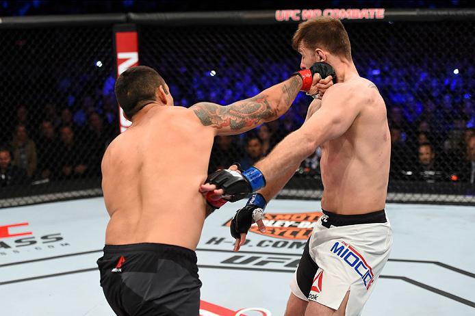 CURITIBA, BRAZIL - MAY 14: (L-R) Fabricio Werdum of Brazil punches Stipe Miocic tin their UFC heavyweight championship bout during the UFC 198 event at Arena da Baixada stadium on May 14, 2016 in Curitiba, Parana, Brazil. (Photo by Josh Hedges/Zuffa LLC