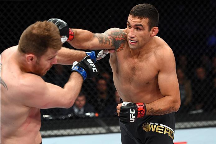 CURITIBA, BRAZIL - MAY 14: (R-L) Fabricio Werdum of Brazil punches Stipe Miocic in their UFC heavyweight championship bout during the UFC 198 event at Arena da Baixada stadium on May 14, 2016 in Curitiba, Parana, Brazil. (Photo by Josh Hedges/Zuffa LLC/