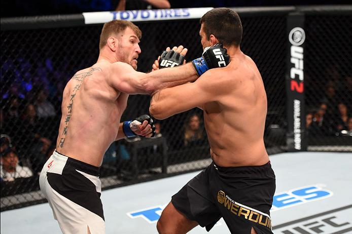 CURITIBA, BRAZIL - MAY 14: (L-R) Stipe Miocic punches Fabricio Werdum of Brazil in their UFC heavyweight championship bout during the UFC 198 event at Arena da Baixada stadium on May 14, 2016 in Curitiba, Parana, Brazil. (Photo by Josh Hedges/Zuffa LLC/