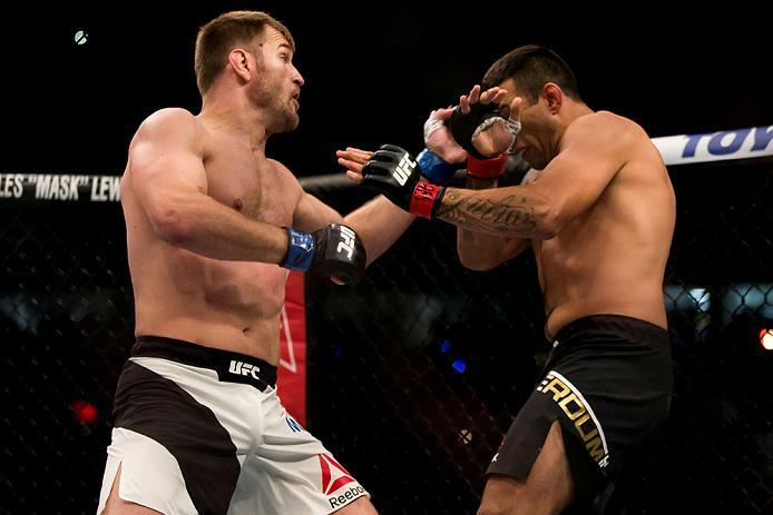 CURITIBA, BRAZIL - MAY 14: Stipe Miocic of the United States punches Fabricio Werdum of Brazil in their heavyweight bout during the UFC 198 at Arena da Baixada stadium on May 14, 2016 in Curitiba, Brazil. (Photo by Buda Mendes/Zuffa LLC/Zuffa LLC via Gett