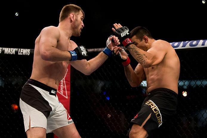 CURITIBA, BRAZIL - MAY 14: Stipe Miocic of the United States punches Fabricio Werdum of Brazil in their heavyweight bout during the UFC 198 at Arena da Baixada stadium on May 14, 2016 in Curitiba, Brazil. (Photo by Buda Mendes/Zuffa LLC/Zuffa LLC via Gett