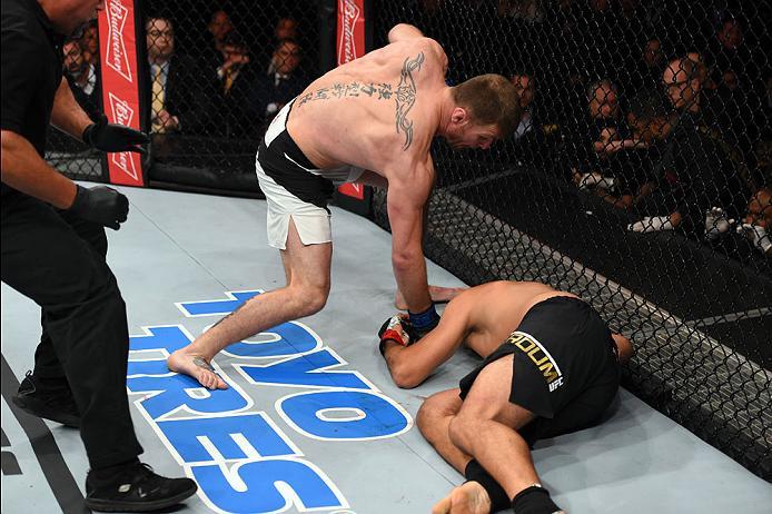 CURITIBA, BRAZIL - MAY 14: (L-R) Stipe Miocic punches Fabricio Werdum of Brazil in their UFC heavyweight championship bout during the UFC 198 event at Arena da Baixada stadium on May 14, 2016 in Curitiba, Parana, Brazil. (Photo by Josh Hedges/Zuffa LLC/