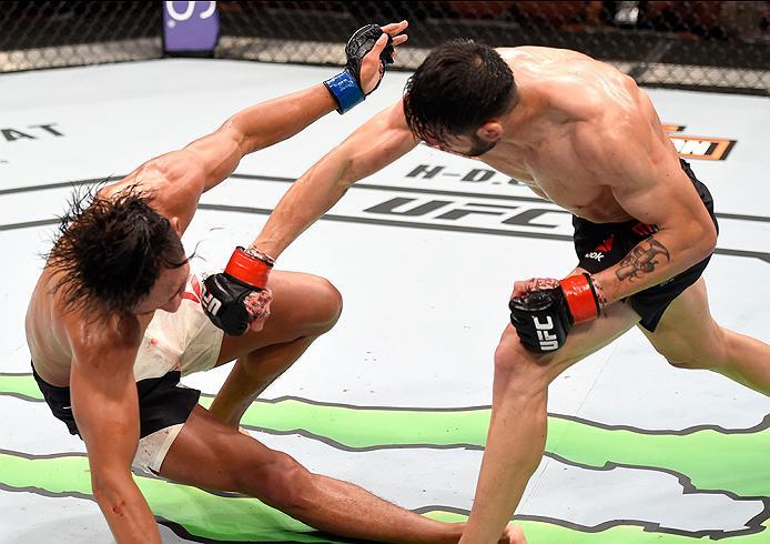 INGLEWOOD, CA - JUNE 04: Polo Reyes of Mexico lands a right punch to the face of Dong Hyun Kim during their lightweight bout during the UFC 199 event at The Forum on June 4, 2016 in Inglewood, California. (Photo by Josh Hedges/Zuffa LLC/Zuffa LLC via Ge